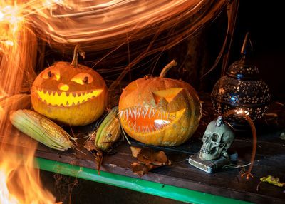 Close-up of illuminated pumpkin on table