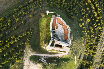 High angle view of house amidst trees and buildings