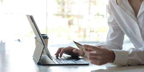 Low angle view of person working on table