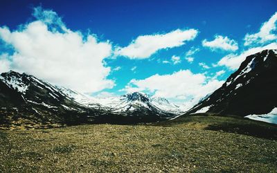 Scenic view of snowcapped mountains against sky