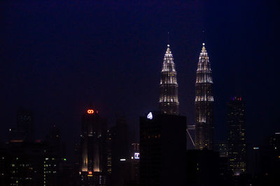 Illuminated buildings in city at night