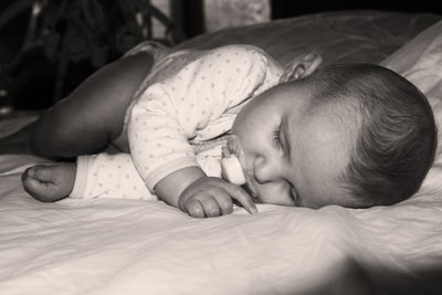 Cute baby sleeping on bed