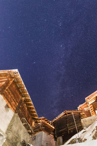 Low angle view of old building against sky at night