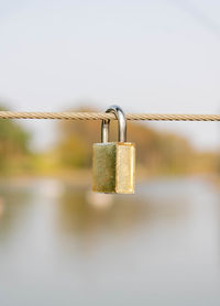 Close-up of padlocks on railing