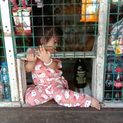 Full length of girl playing at the market