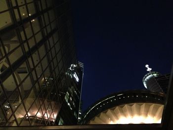 Low angle view of illuminated building at night