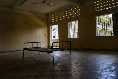 Empty chair in abandoned building