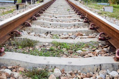 High angle view of railroad tracks on field