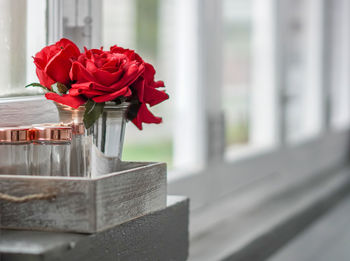 Close-up of red rose on table