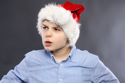 Portrait of boy against white background