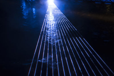 High angle view of illuminated bridge against sky at night