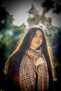 Portrait of beautiful young woman outdoors