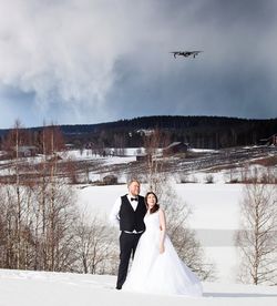 People on snow covered landscape during winter