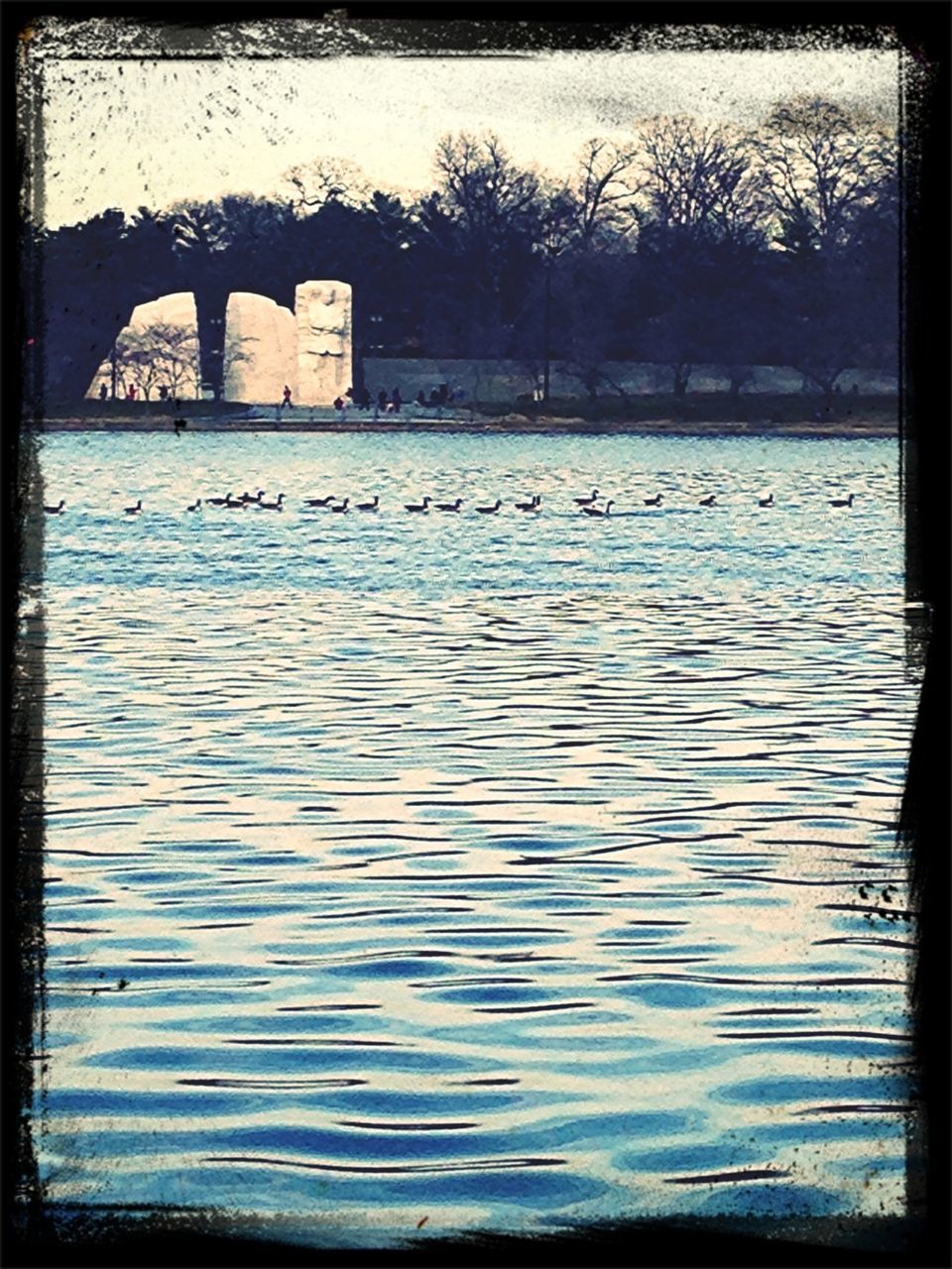 water, architecture, built structure, transfer print, building exterior, auto post production filter, river, tree, waterfront, bare tree, arch, reflection, sky, day, lake, travel destinations, outdoors, nature, bridge - man made structure, no people