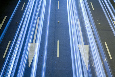 High angle view of light trails on road at night