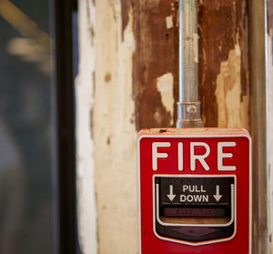 Close-up of warning sign on wall