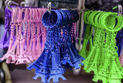 Close-up of colorful eiffel tower key rings for sale