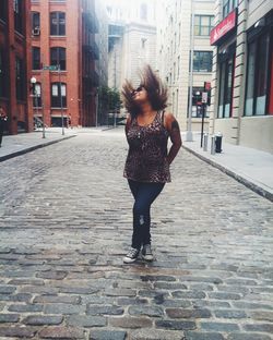 Woman standing in front of building