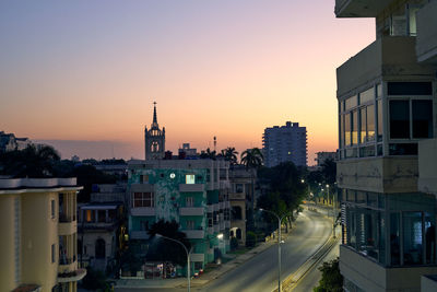 Cityscape against clear sky during sunset