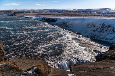 Scenic view of snowcapped landscape against sky