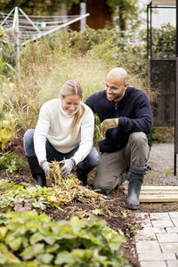 Mature couple gardening at yard