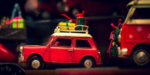 Red toy car on street in city