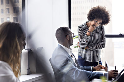 Business colleagues discussing during meeting in office