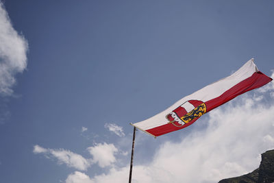 Low angle view of flag against sky