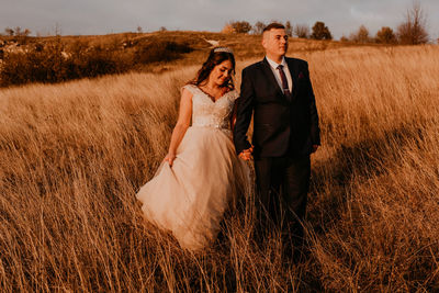 Portrait of bride standing on field