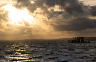 Ruined brighton west pier with sunset sky