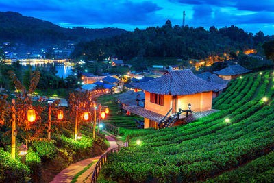 High angle view of illuminated buildings in city at night