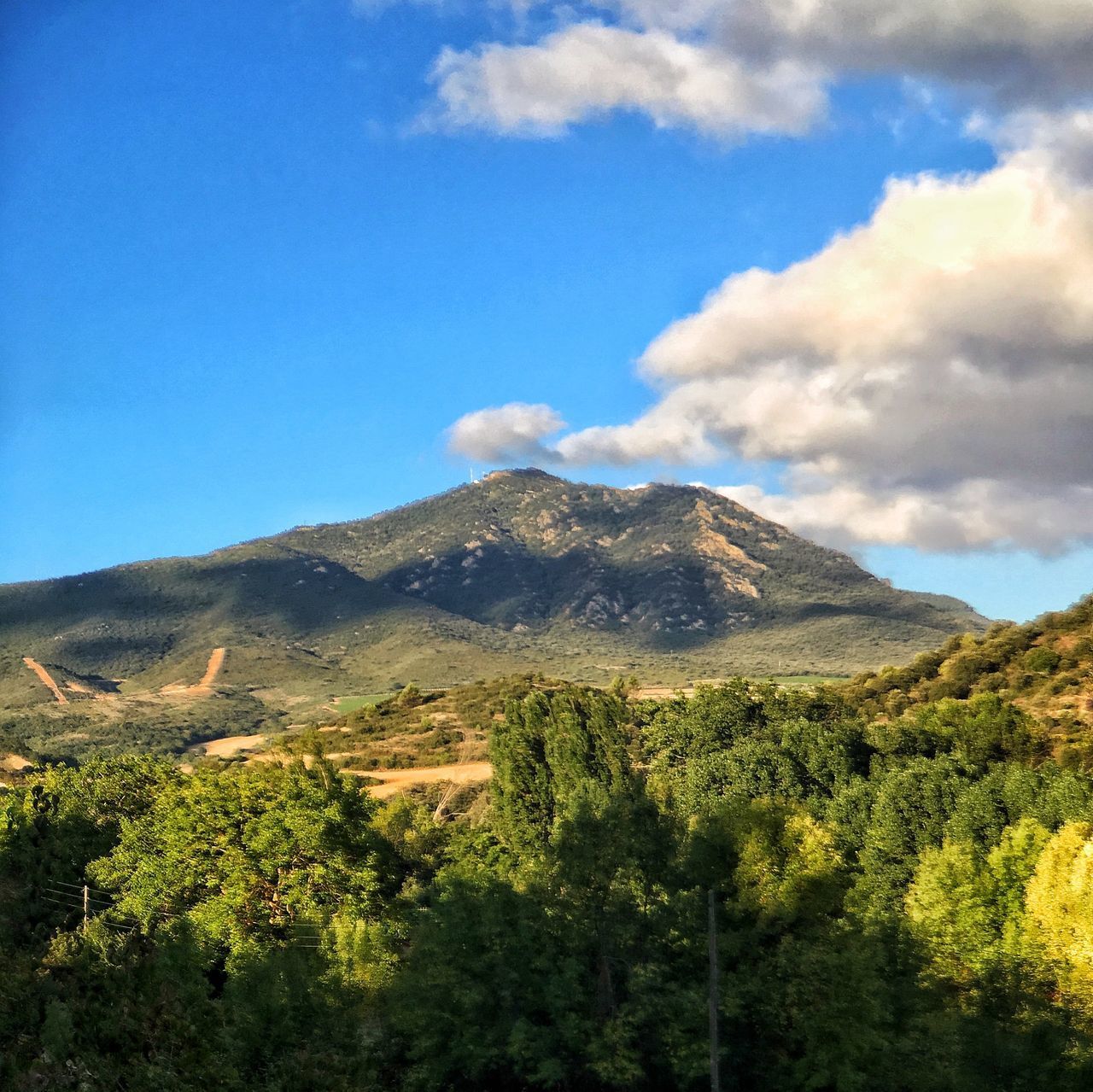 SCENIC VIEW OF MOUNTAIN AGAINST SKY