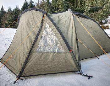 Tent on snow covered land