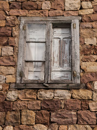 Low angle view of window on old building