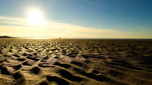 Scenic view of beach against sky during sunset