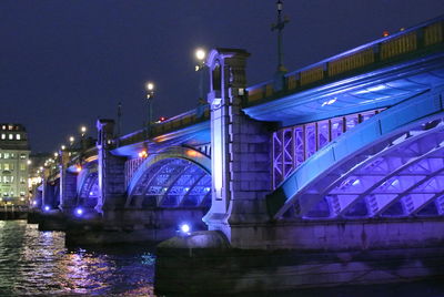 Bridge over river at night