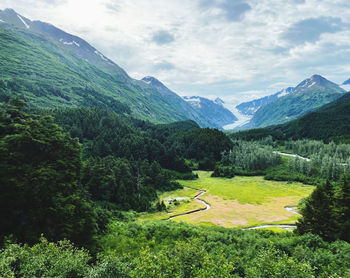 Beautiful scenic view of mountains and a glacier. 

