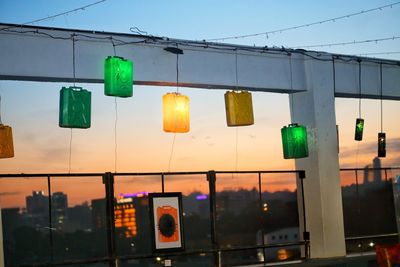 Multi colored lights against sky at sunset