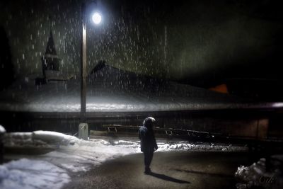 Silhouette of woman at night