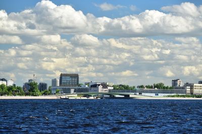 Scenic view of sea and buildings against sky