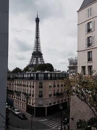 Low angle view of tower against cloudy sky