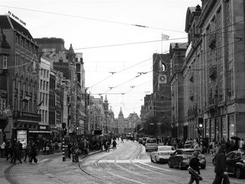 City street and buildings against sky