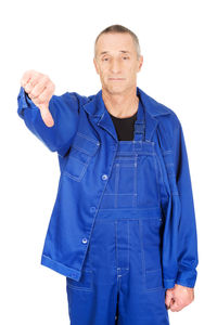 Portrait of man standing against white background