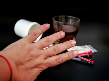 Cropped image of people holding drink