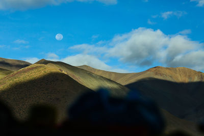 Scenic view of sand dune against sky