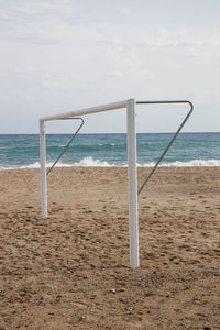 Soccer on beach against sky