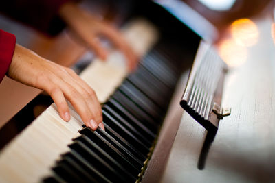 Close-up of hand playing guitar