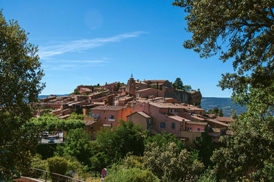 Panoramic view of the roussillon village and surrounding woods, in the french provence.