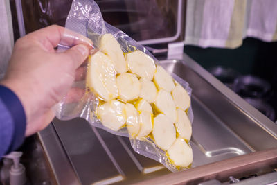 Close-up of hand holding ice cream