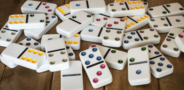 Close-up of dominos on wooden table